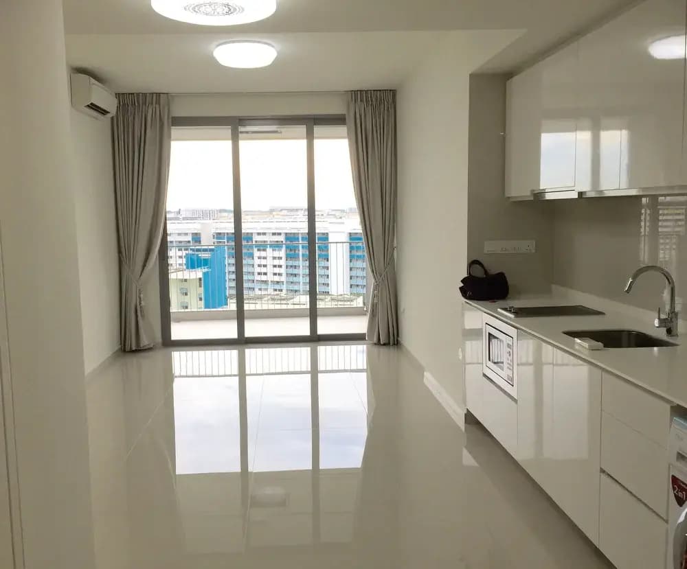 White condo kitchen opening to a balcony