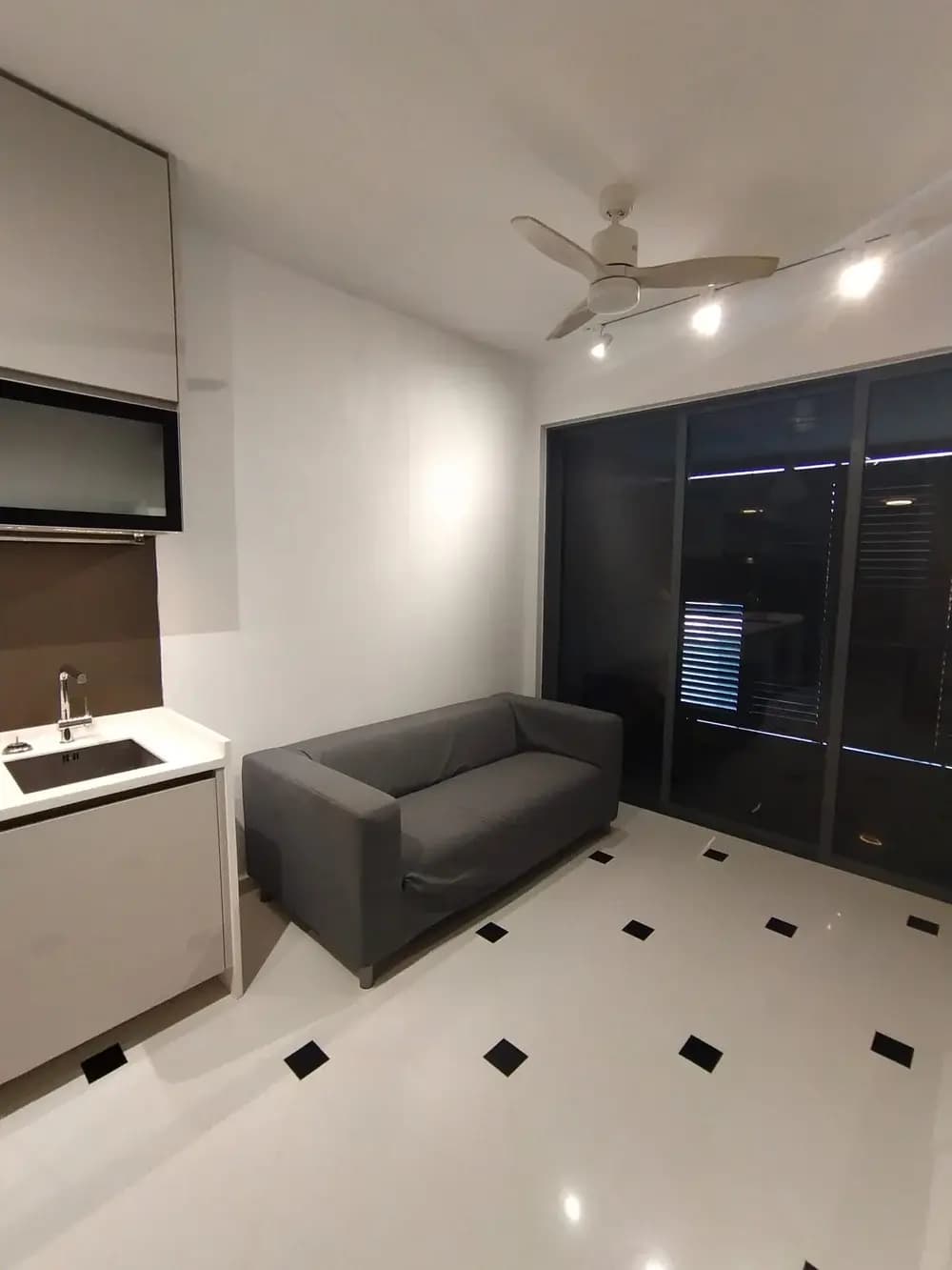 Clean living area with balcony doors