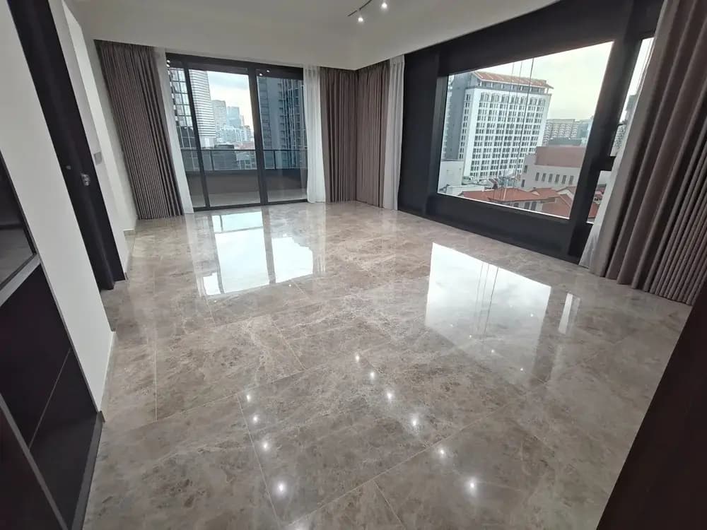 Empty condo living room with marble floor